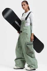Salopette de ski Gsou Snow pour femme, style vêtements de travail, vert menthe, avec ceinture intégrée et coupe très ample. 